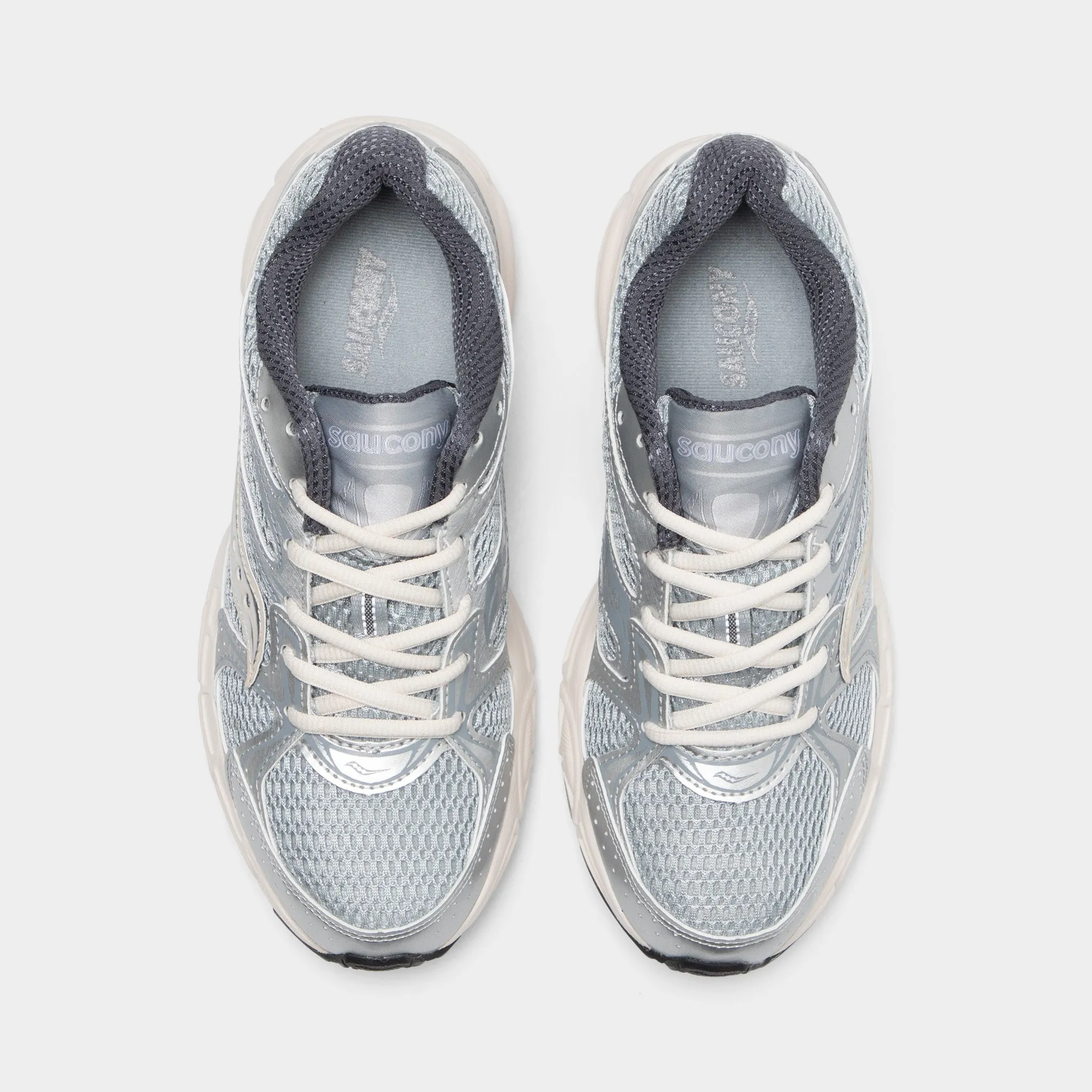 Saucony Women's Ride Millennium Silver / Cream running in a polar area Trendy Look