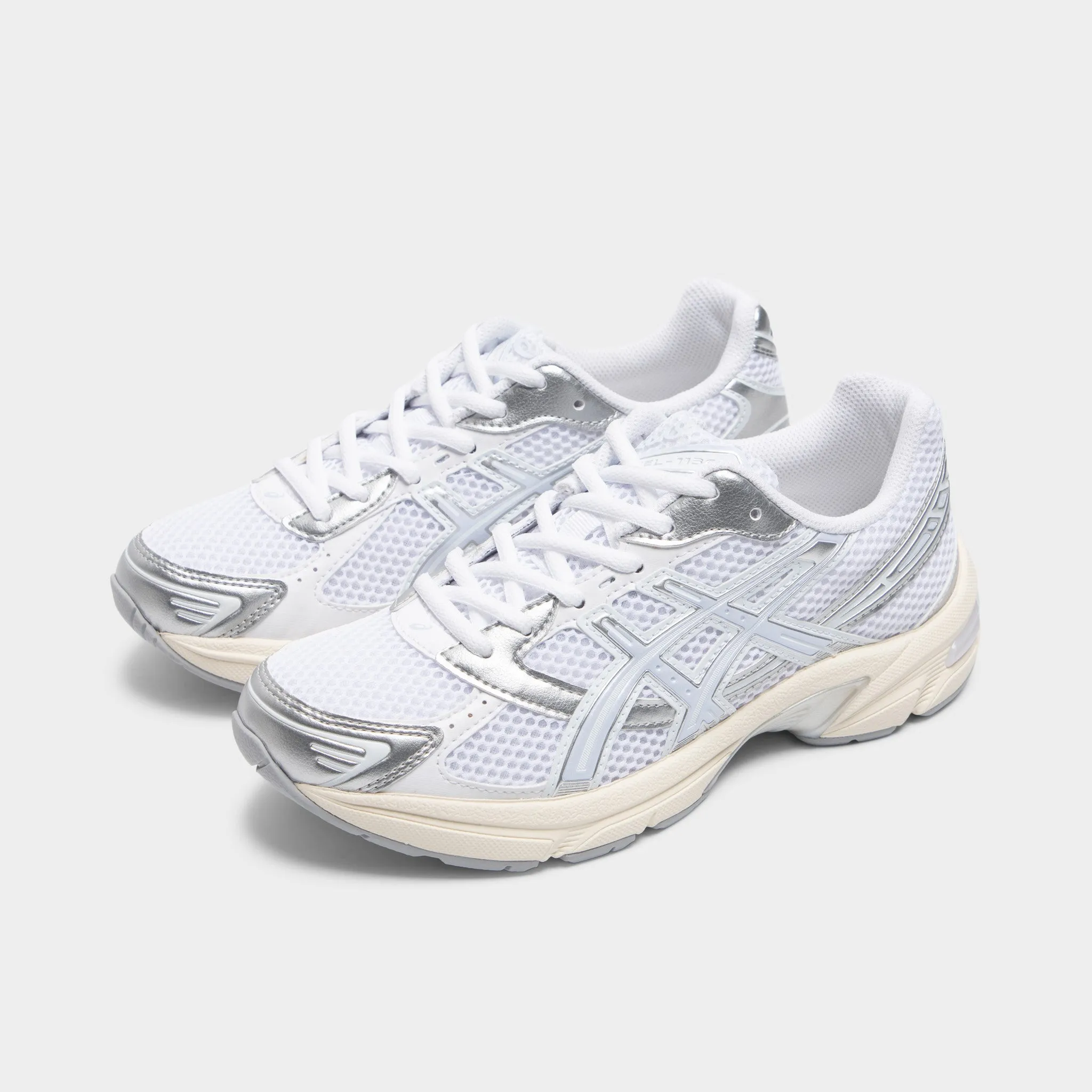 ASICS Women's GEL-1130 White / Blue Fade running on an outdoor track shoes