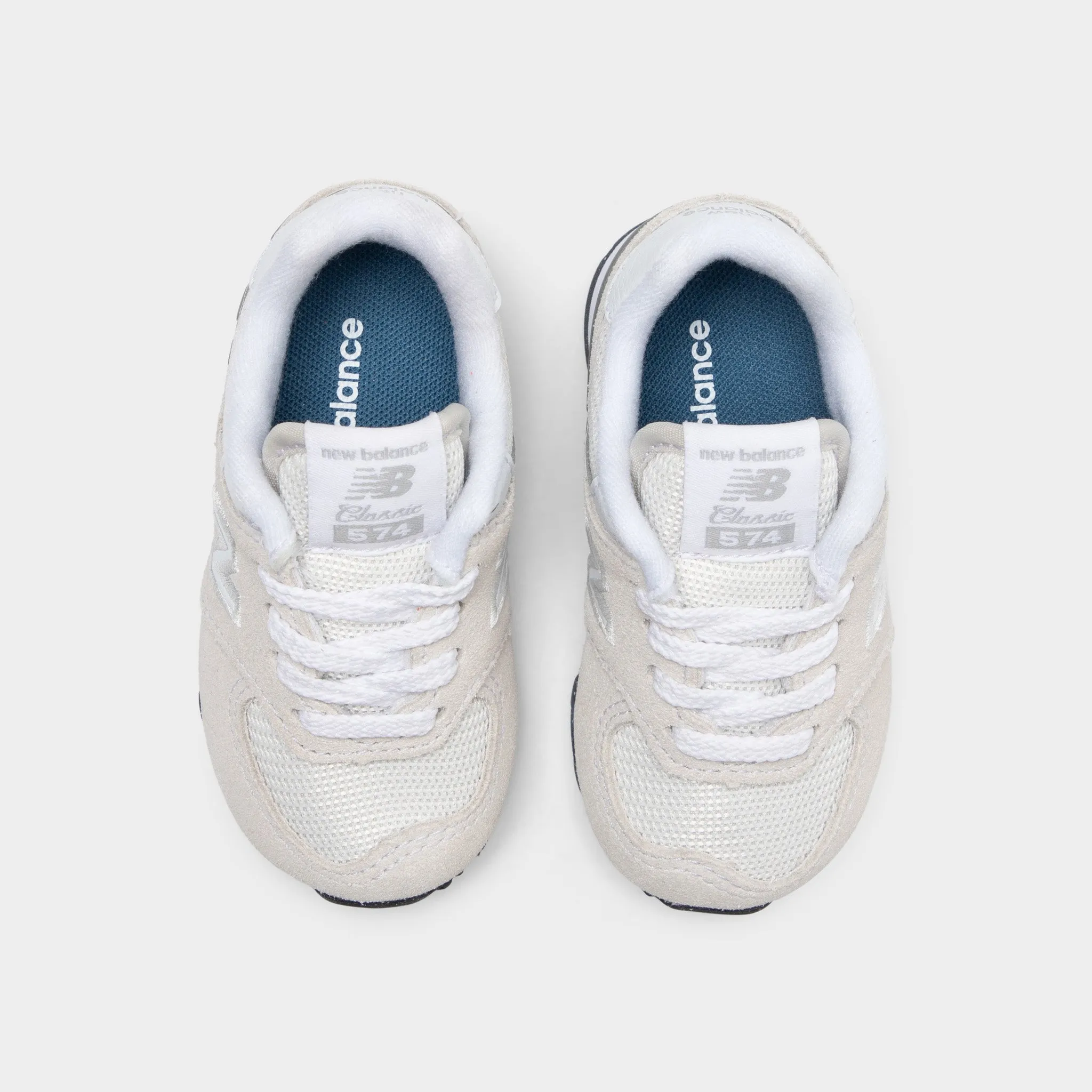 running in a stadium New Balance Infants' 574 Light Grey / White
