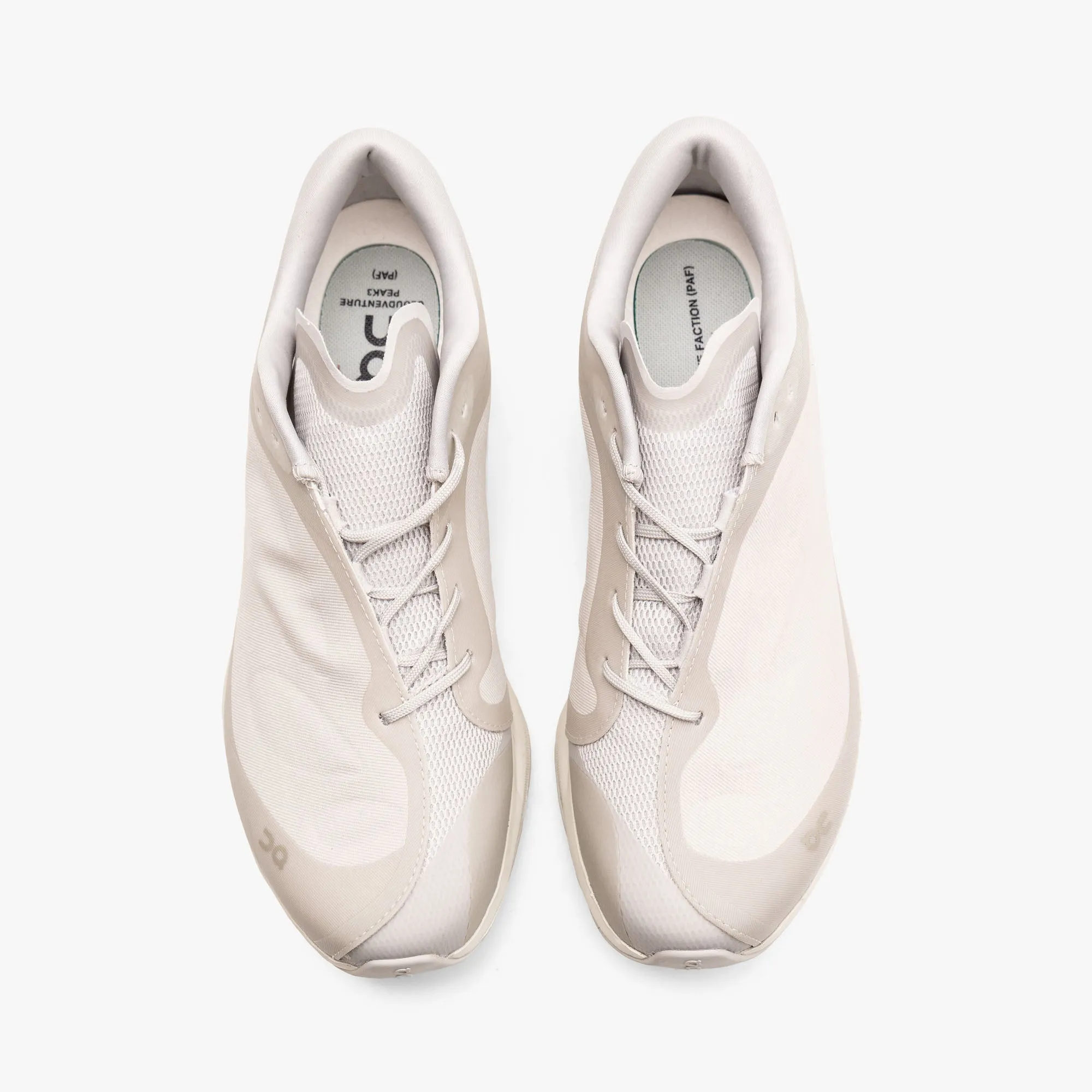 On x PAF Cloudventure Peak Ice / Moondust running in a neighborhood