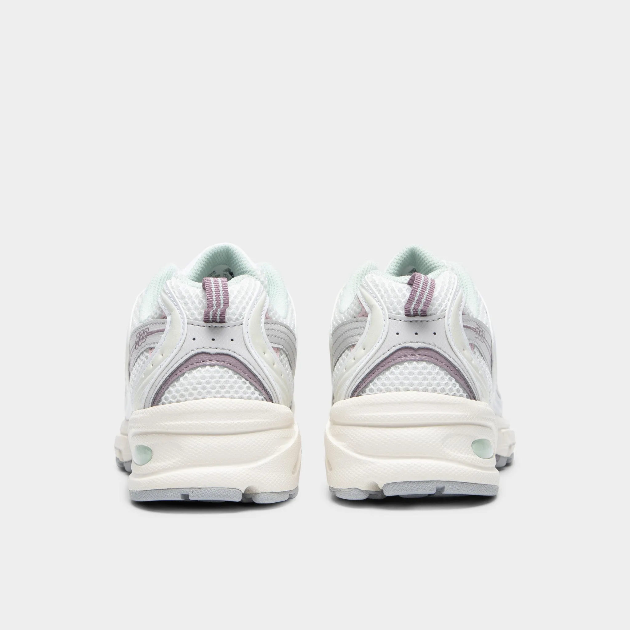 New Balance 530 Sea Salt / Ice Wine - Rose Sugar running in a relay race Muddy running
