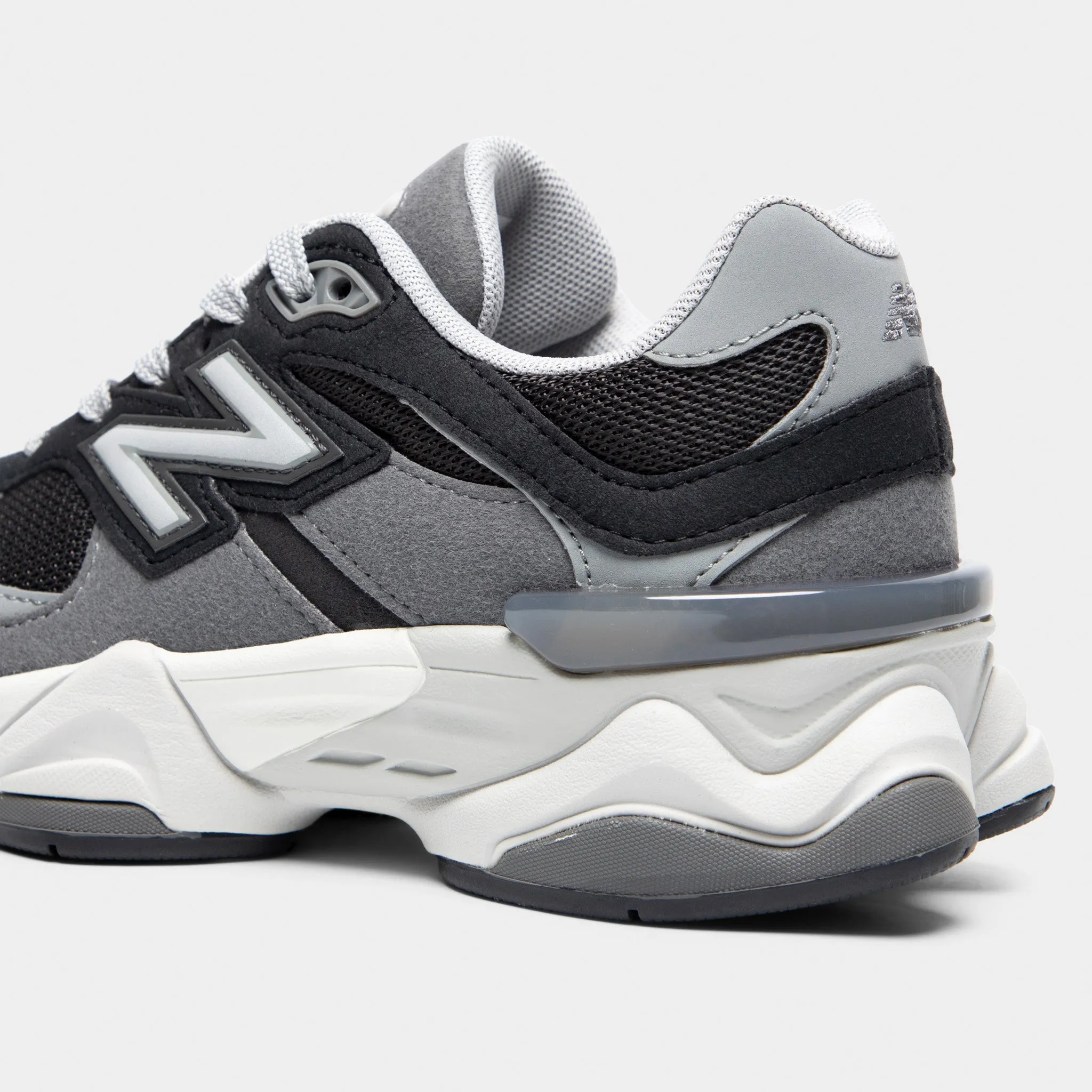 New Balance Juniors' 9060 Black / Castlerock running on inclined ground Breathable Inserts