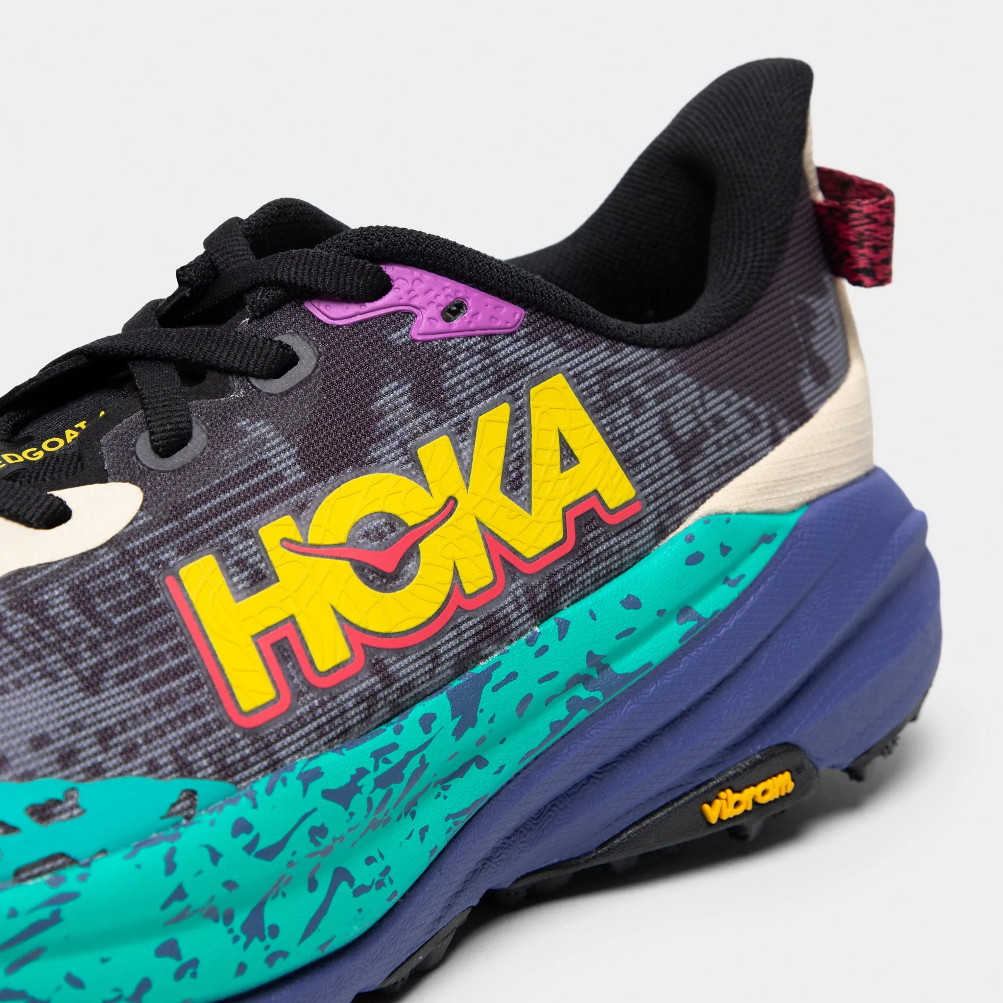 Hoka Speedgoat 6 Grey / Purple - Yellow running in a sports complex shoes solid - color running shoes