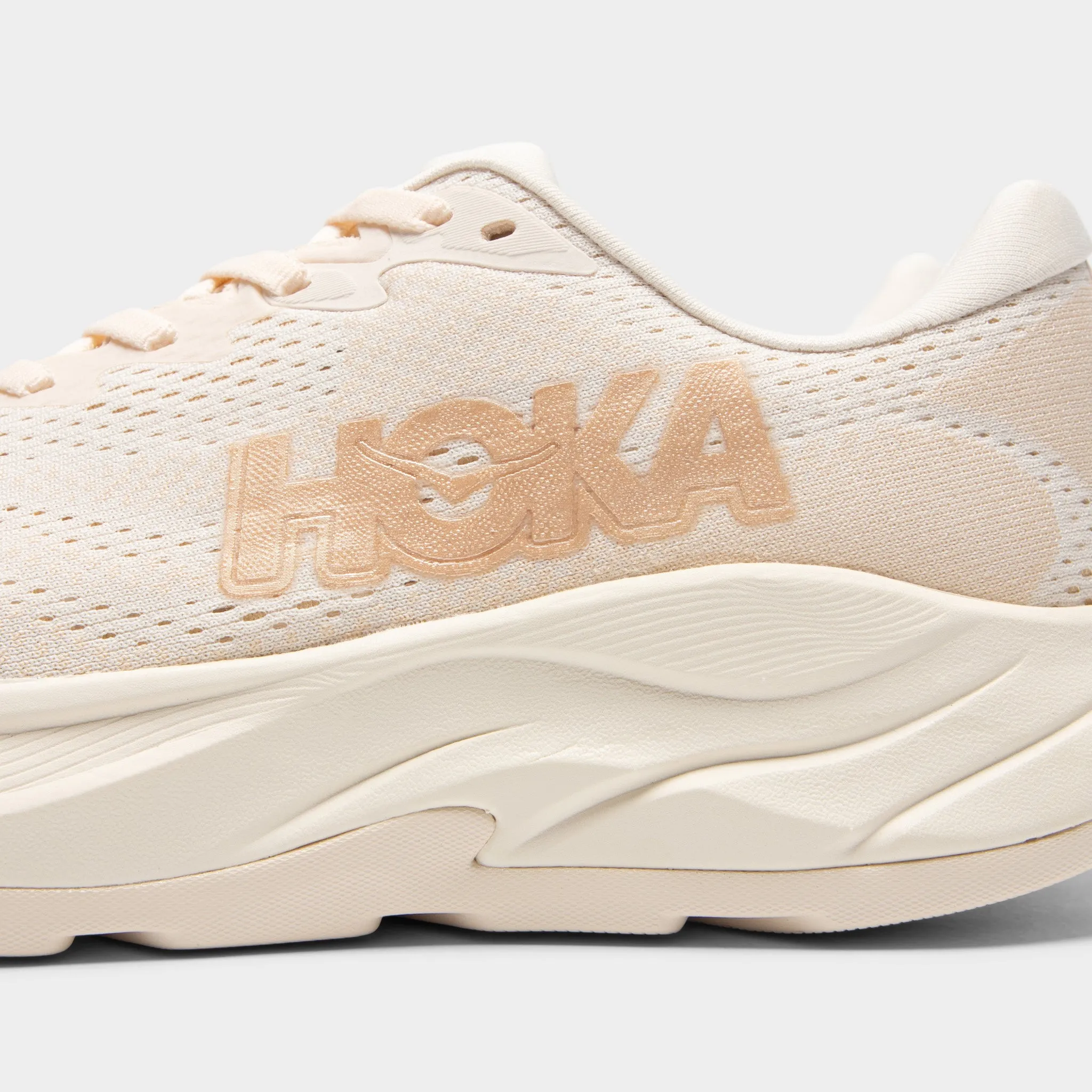 Hoka Women's Rincon 4 Vanilla / Birch buckle closure shoes running during a full moon