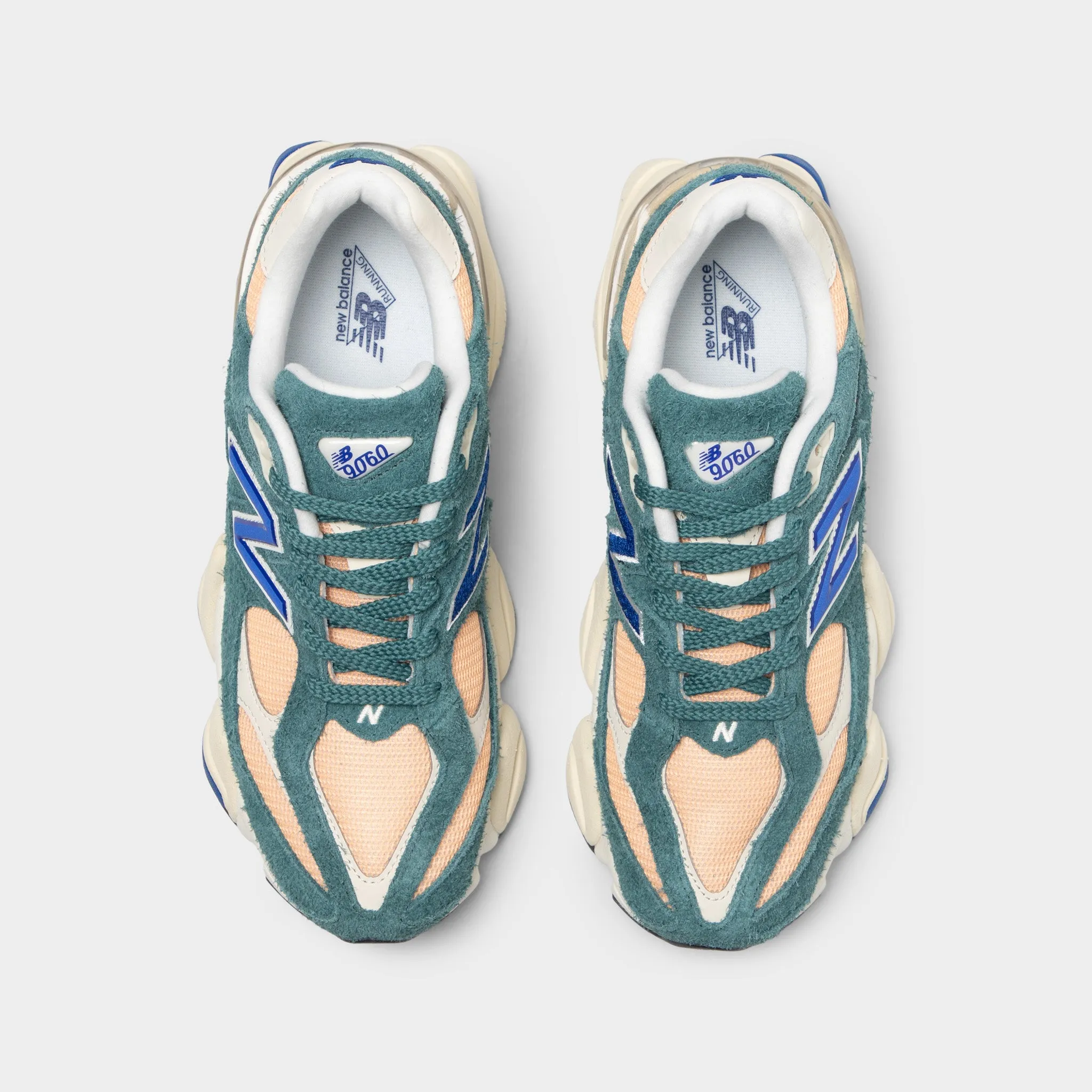 New Balance 9060 New Spruce / Peach Blossom Happiness running in a geyser area shoes