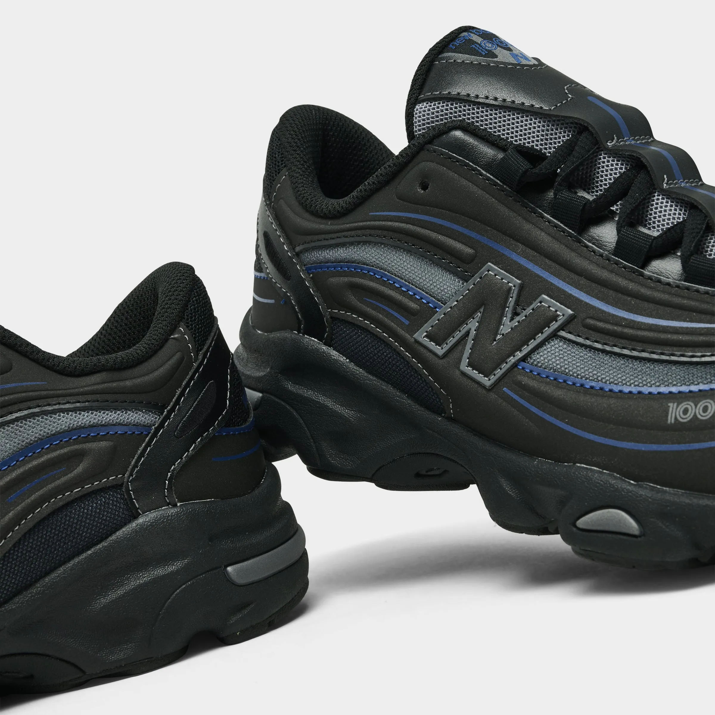 New Balance Juniors' 1000 Black / Galaxy Blue asphalt running footwear