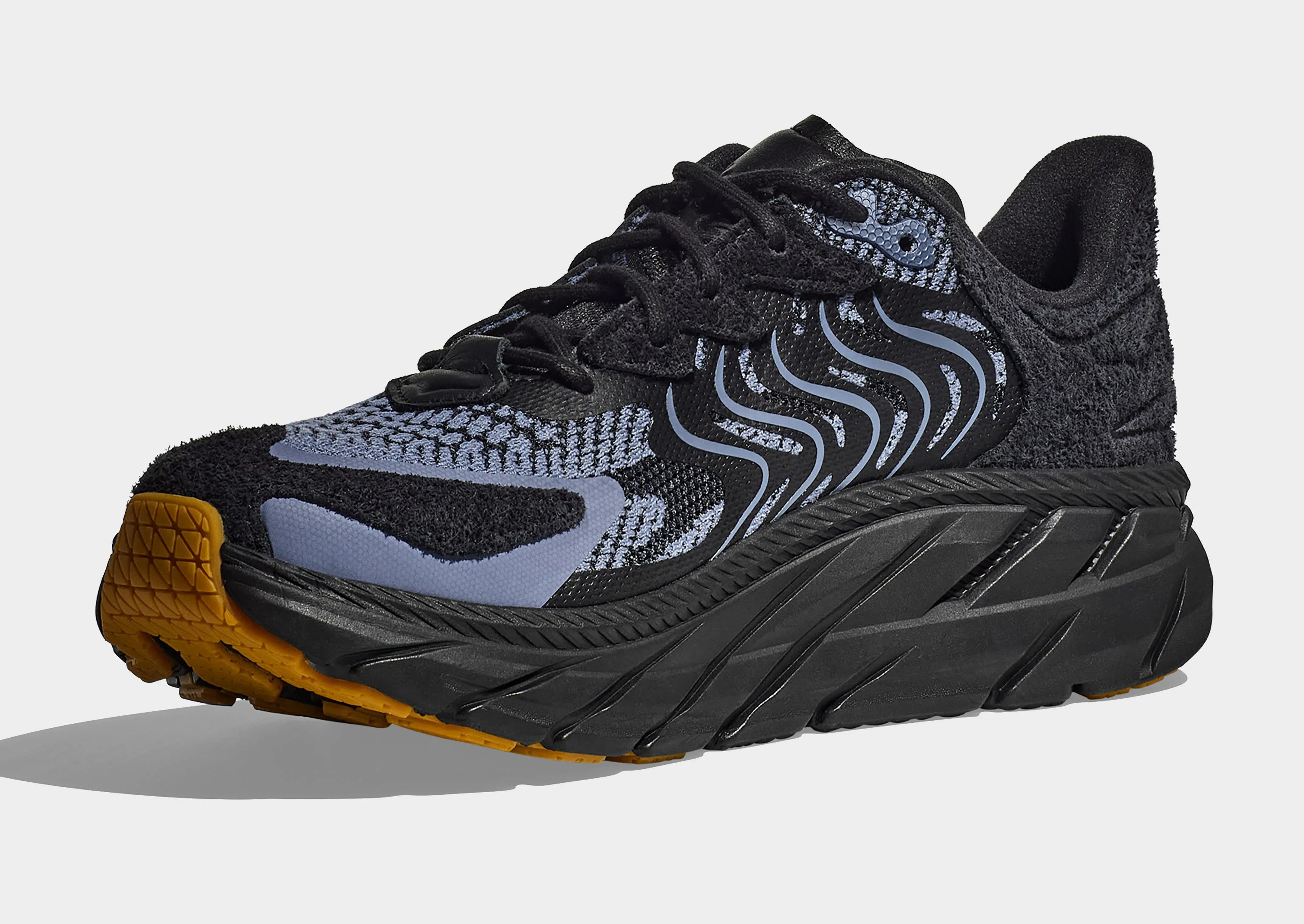 Clifton LS Women's running in an estuary area shoes