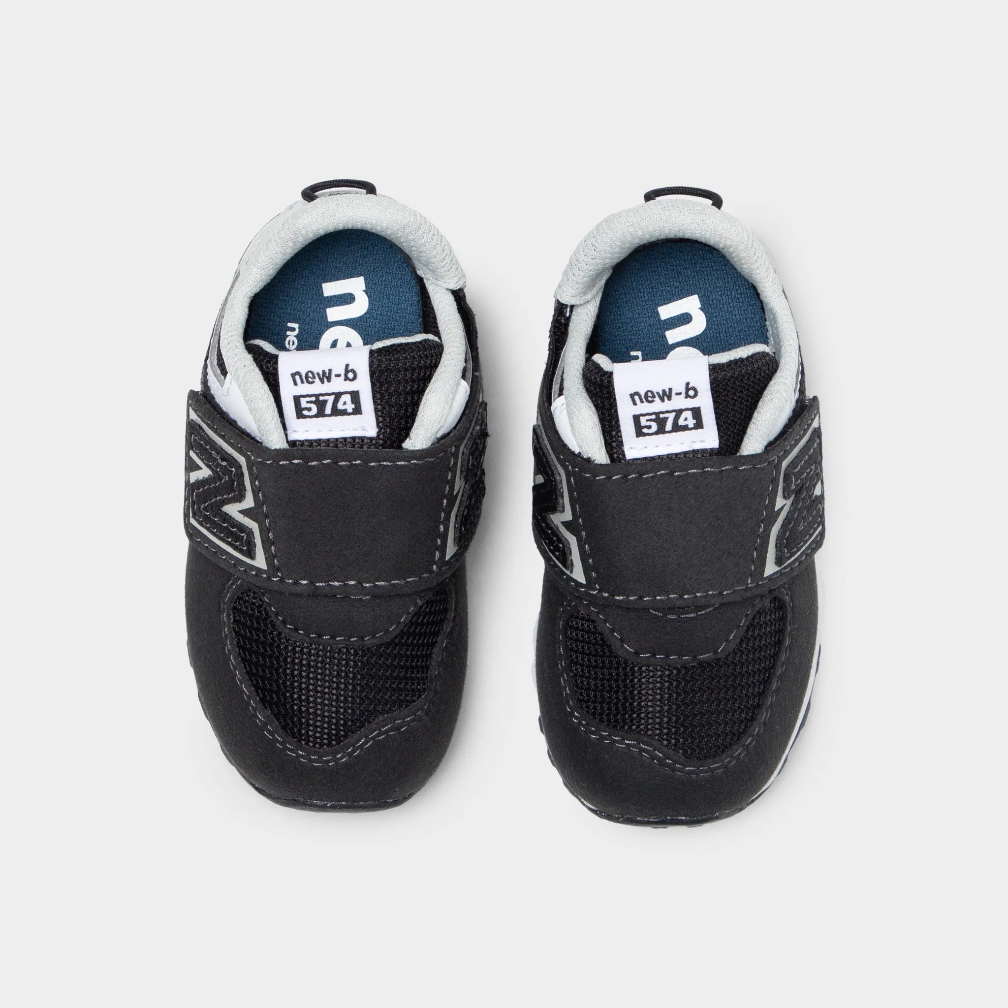 New Balance Infants' 574 Black / White roller skating shoes fair play