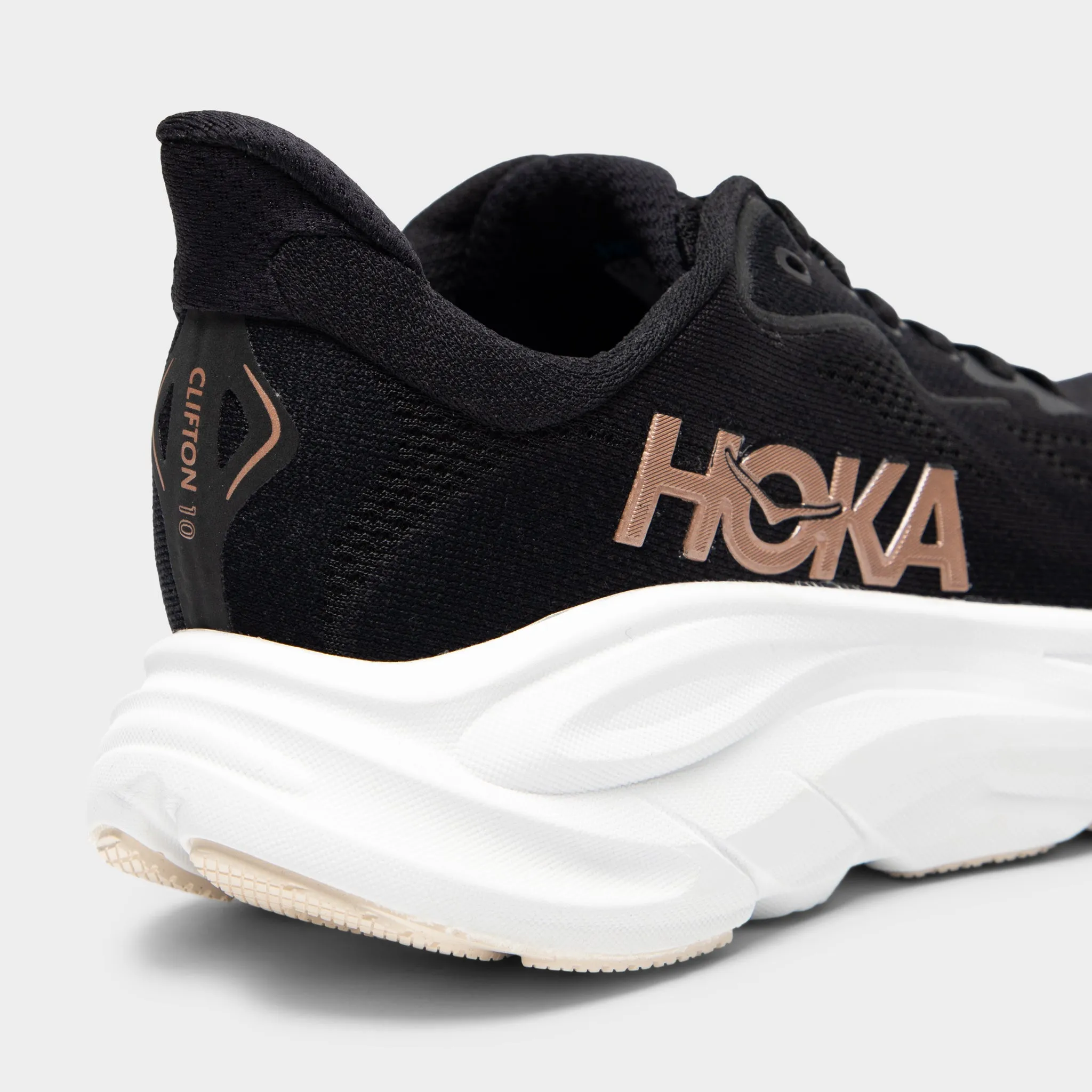 Hoka Women's Clifton 10 Black / White - Rose Gold anaerobic running gear