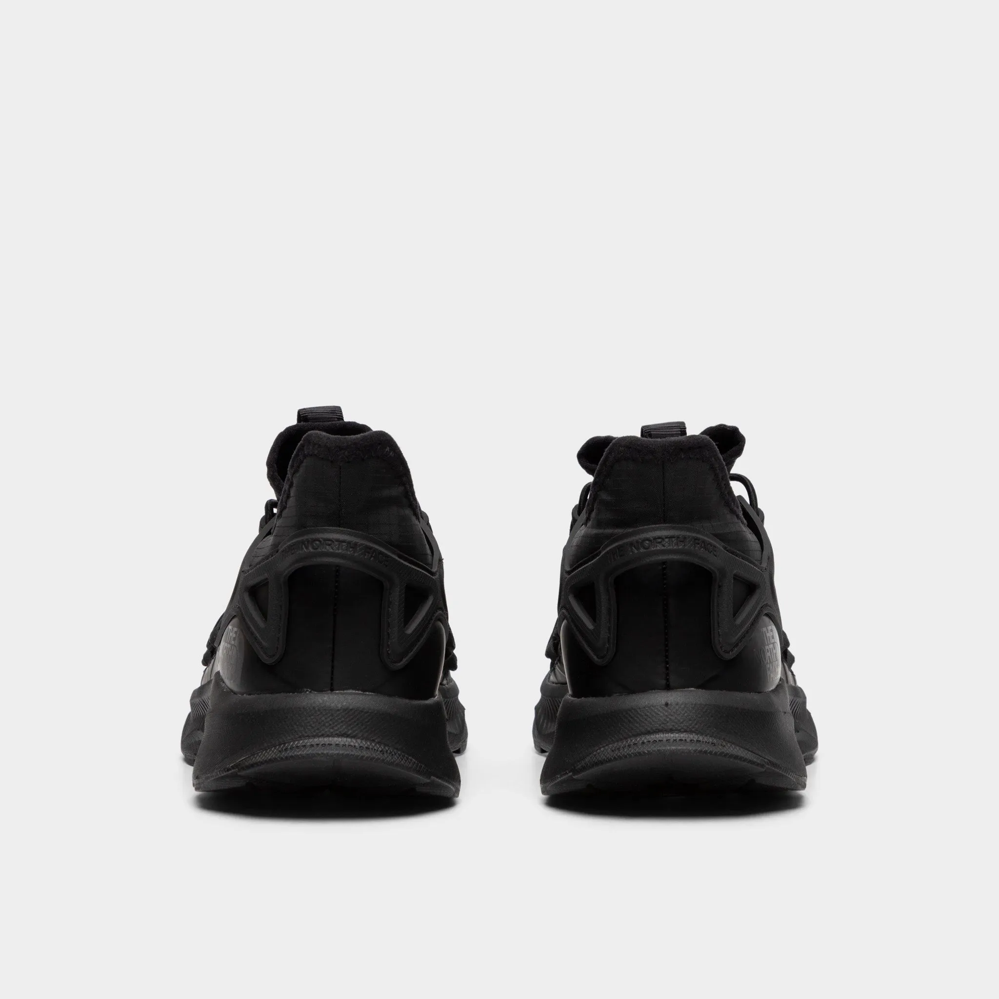 The North Face Women's Oxeye Tech Black / Black running with a group running in smooth tracks shoes