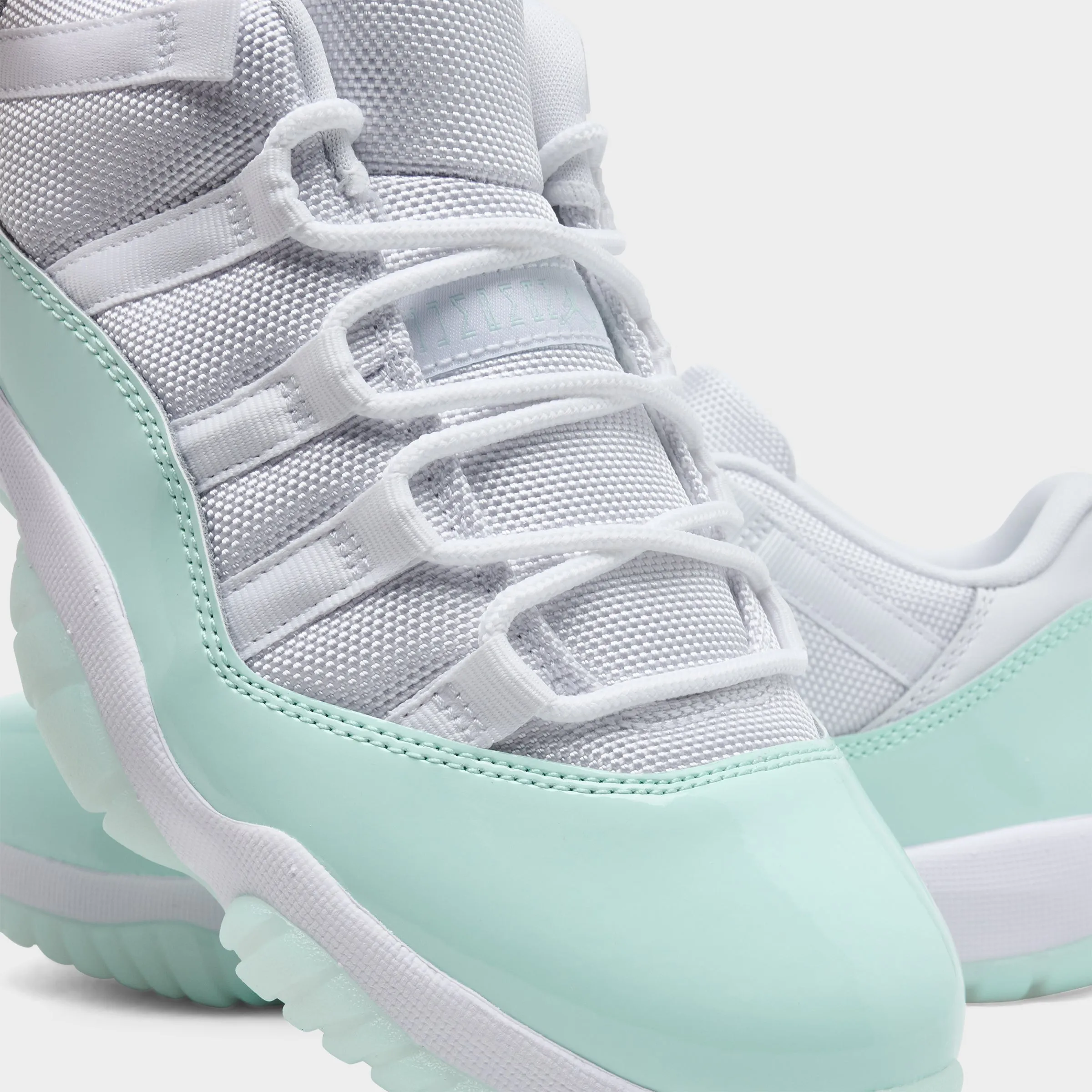 Jordan Women's 11 Retro Low White / Igloo Impact Resistant Construction Reinforced toe